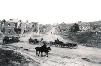© Philippe Gorczynski Canadian troops passing through a village devastat